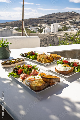 Breakfast and Brunch Spread Served Outdoors on a Terrace Overlooking a Mediterranean Village
