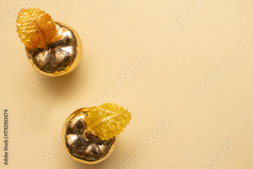 Golden Christmas ornaments on a colorful background