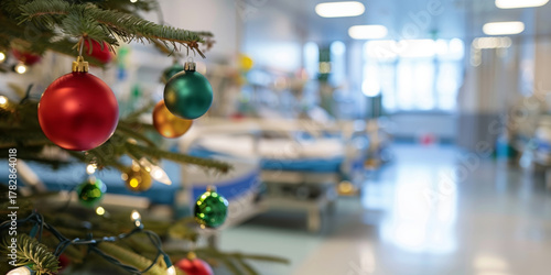 Colorful Christmas ornaments on a tree in a hospital ward. Holiday decorations in a medical setting, creating a festive atmosphere for patients and staff.