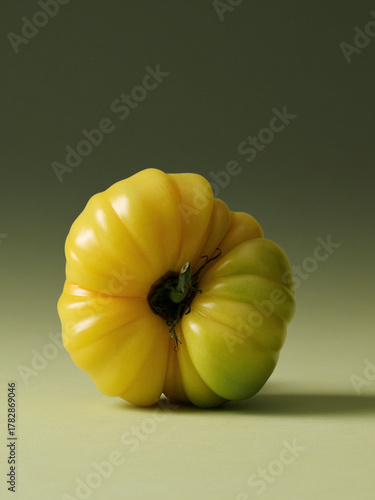 Yellow Heirloom Tomatoes Painterly Still Life on Green Seamless background. Film grain