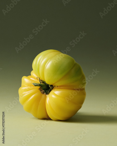 Yellow Heirloom Tomatoes Painterly Still Life on Green Seamless background. Film grain