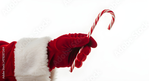 Santa’s hand holding a candy cane, isolated on white — playful and bright for Christmas visuals.