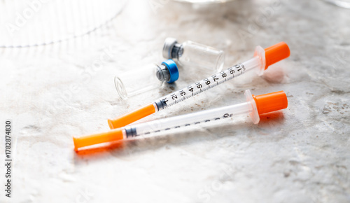 Close up of Single Use Syringes with Small Glass Vials