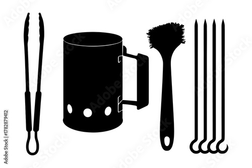 Essential bbq tools: chimney starter, tongs, brush, skewers set for grilling.