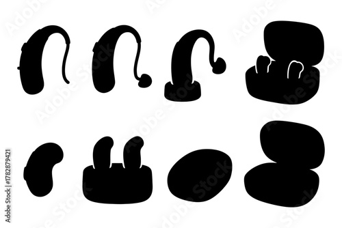 Silhouette collection of various hearing aids and charging cases on white background.