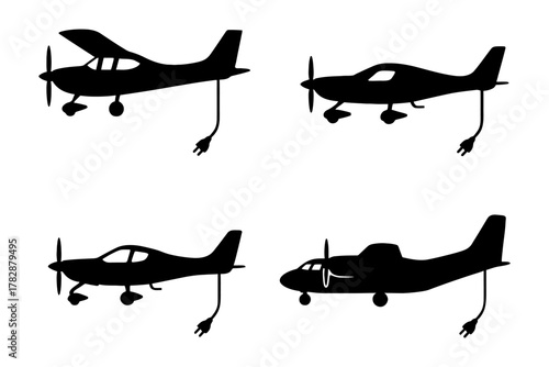 Silhouette of electric airplanes with charging cords on white background.