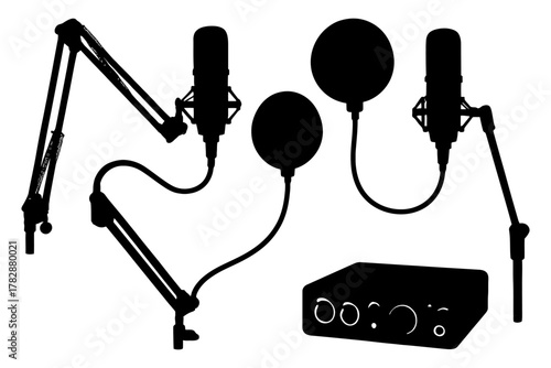 Silhouette of podcast equipment with microphones and audio interface.