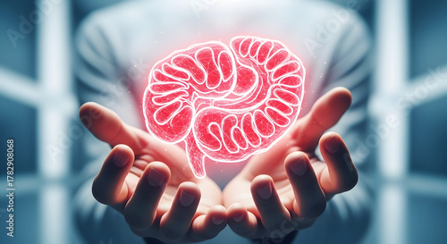 Human hands holding a glowing digital brain model representing neuroscience concept and mental