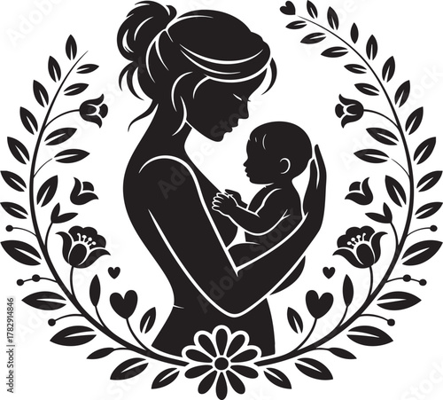 A black silhouette of a mother holding her baby, framed by a circular floral and leaf wreath. Symbolizes love and family.