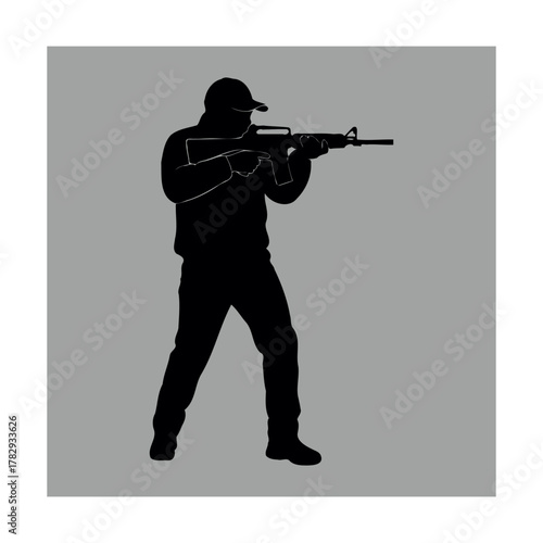 Silhouette of a Tactical Shooter Aiming a Rifle