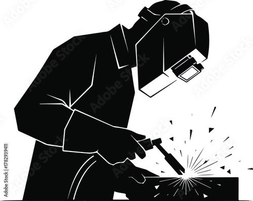 A worker in a protective suit and welding helmet creating sparks while welding a piece of metal with a silhouette effect on a clean white background.