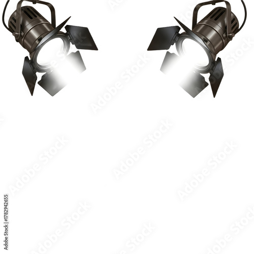 Two vintage stage spotlights shining brightly against a dark backdrop