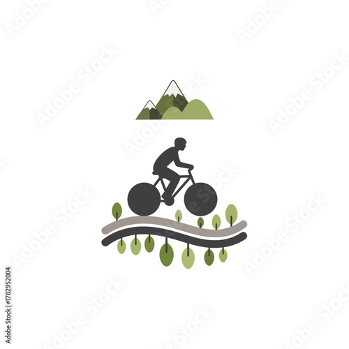 Silhouette of a cyclist riding on a winding path with mountains in the background.
