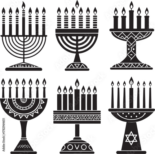 Collection of six kwanzaa african culture black and white menorah candle holders with lit candles and decorative bases