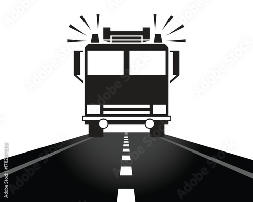 Fire truck on a road with flashing lights and dashed lines