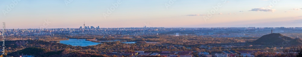 Fototapeta premium Aerial panorama of Beijing city and natural integration skyline at sunset, China