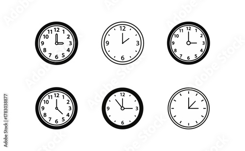 Clock faces showing different times in a black background