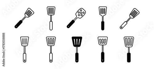 Collection of kitchen spatulas isolated on black background