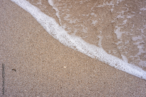 Fototapeta Naklejka Na Ścianę i Meble -  flat lay of sea foam on the beach