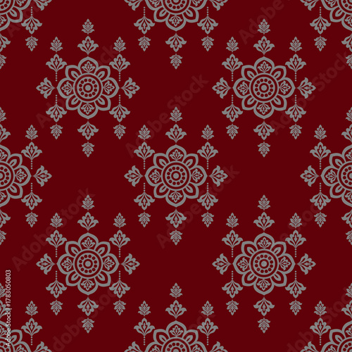 Elegant floral damask pattern with intricate gray motifs on deep red background, creating classic and sophisticated decorative design