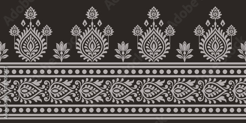 Traditional floral pattern with ornamental leaves and dots in gray on black background, elegant and decorative design for textile or wallpaper