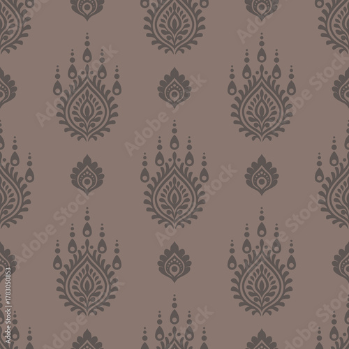 Vintage floral pattern with elegant ornamental motifs in dark brown on muted mauve background, creating classic and sophisticated decorative design