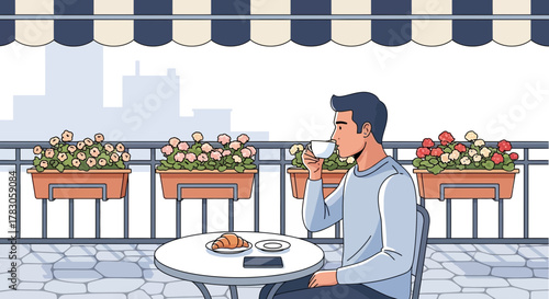 Young male graphic designer enjoying coffee and croissant on balcony with flower boxes, concept for relaxed morning routine, city lifestyle and creative inspiration
