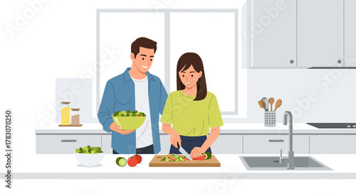 Couple happily preparing fresh salad together in a modern kitchen, promoting healthy lifestyle and togetherness