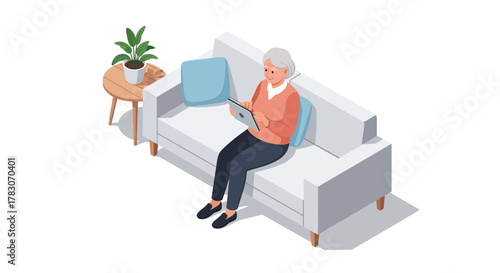 Elegant senior woman comfortably browsing tablet on sofa, enjoying modern home technology and digital connectivity at leisure.