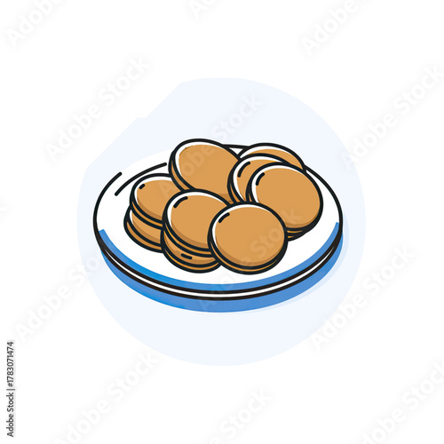 A plate of golden brown pancakes, stacked and arranged, ready to be eaten for breakfast.