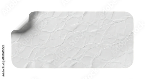 Blank crumpled white paper sticker with peeling corner on black background
