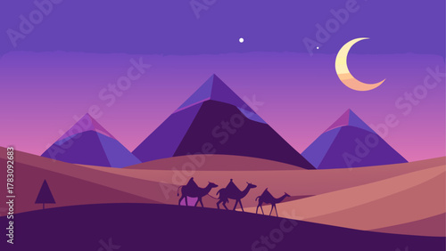 Camels walking in the desert at nighttime