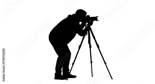 Professional photographer silhouette capturing stunning images with tripod, perfect for illustrating photography skills, equipment, and passion for the art