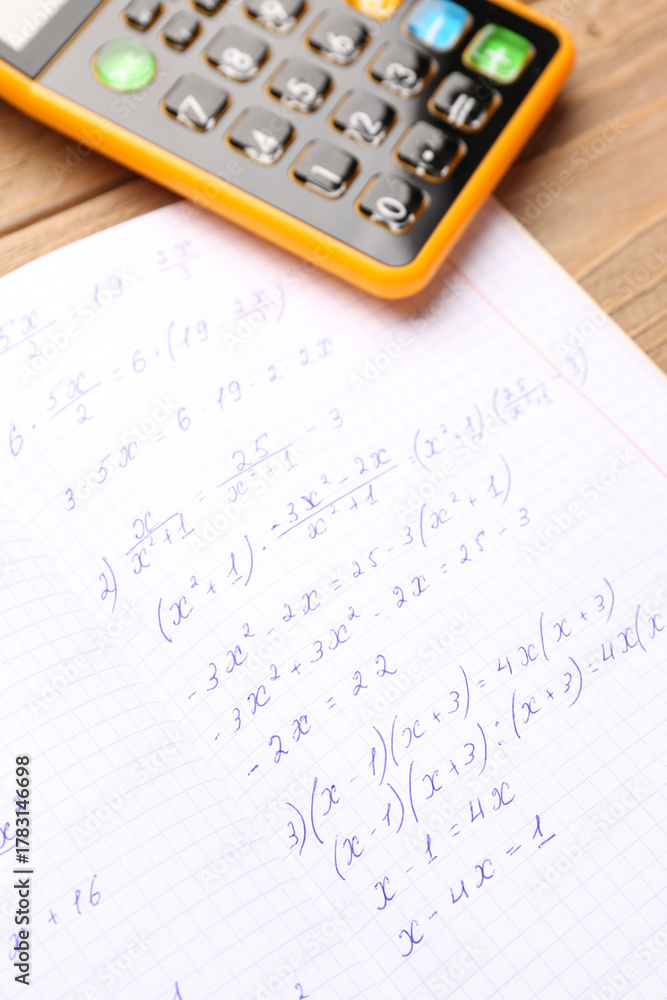 Fototapeta premium Copybook with maths formulas and calculator, closeup