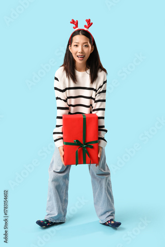Happy young Asian woman in ...