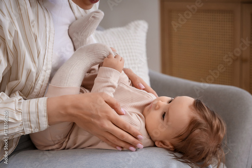 Young mother holding her ba...