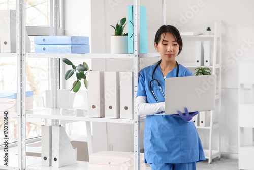 Female Asian doctor working...