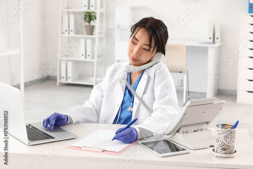 Asian female doctor in lab ...