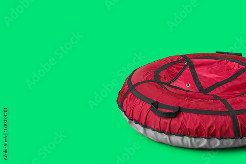 Snow tube on green background