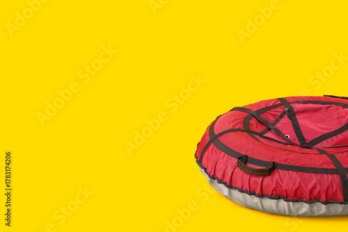 Snow tube on yellow background