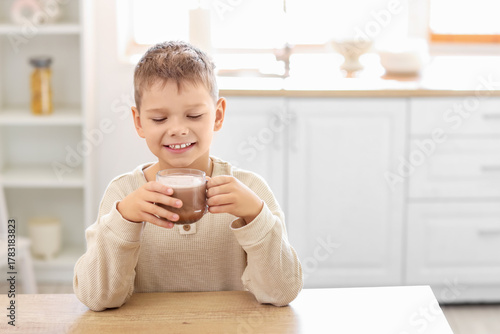 Cute little boy with cup of...