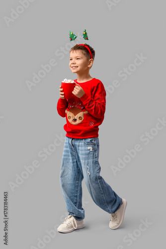Cute little boy with cup of...