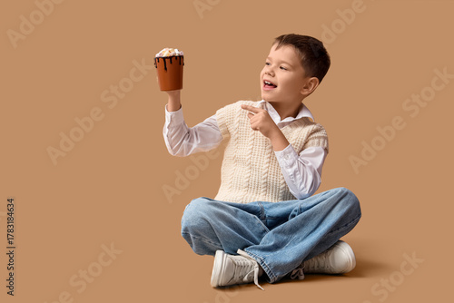 Cute little boy pointing at...