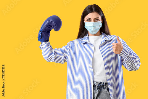 Young woman in medical mask...