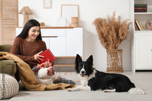 Young woman with book and t...