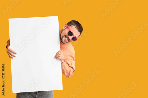 Smiling man in pink sunglas...