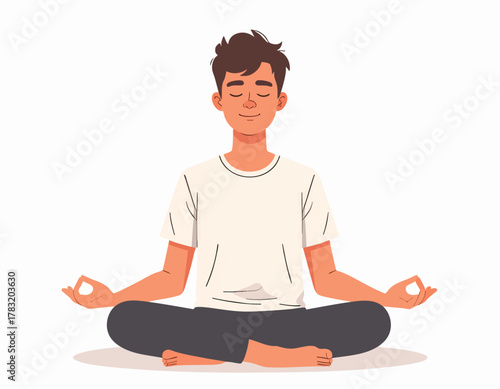 A young man sits in lotus position, meditating with closed eyes.