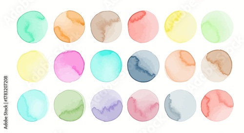 A vibrant set of isolated hand-painted watercolor circles. Colorful abstract round shapes and artistic paint stains for graphic design elements
