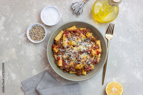 Pasta with bolognese sauce and cheese. Italian cuisine. Traditional recipe.