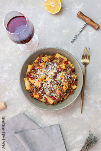 Pasta with bolognese sauce and cheese. Italian cuisine. Traditional recipe.